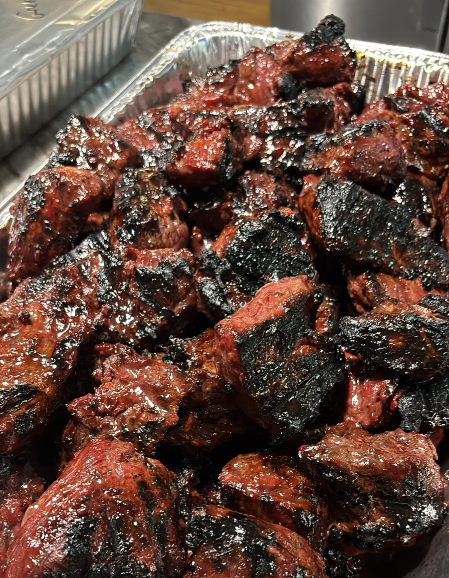 A pan of grilled steak tips